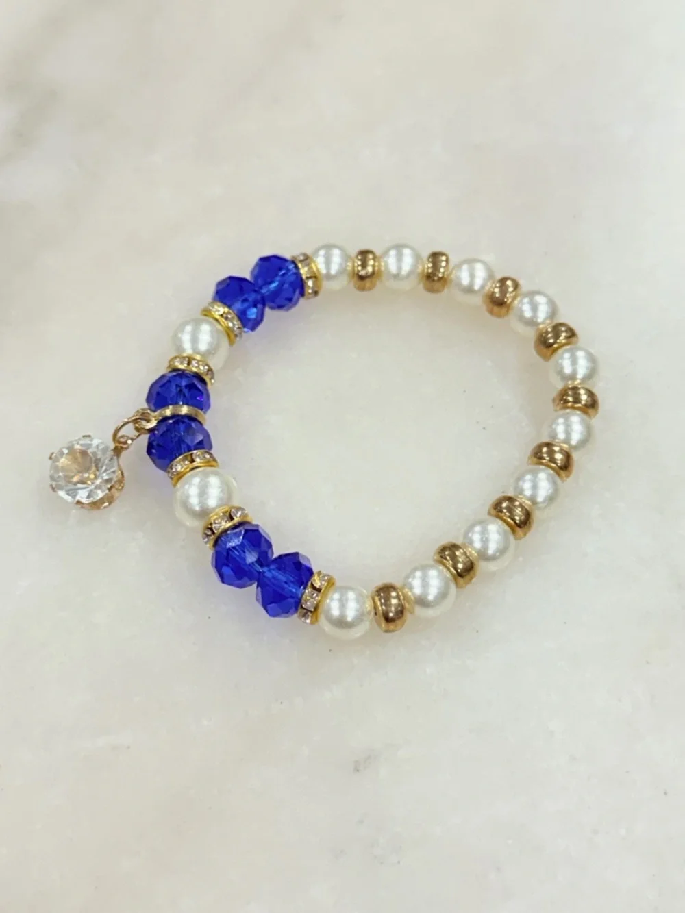 Gold and Pearl Beaded Stretch Bracelet with Blue Crystal Accents and Charm